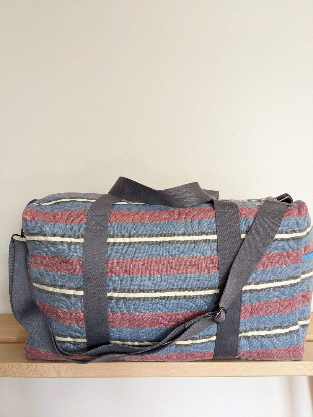 Blue and Red Stripe Duffle Bag